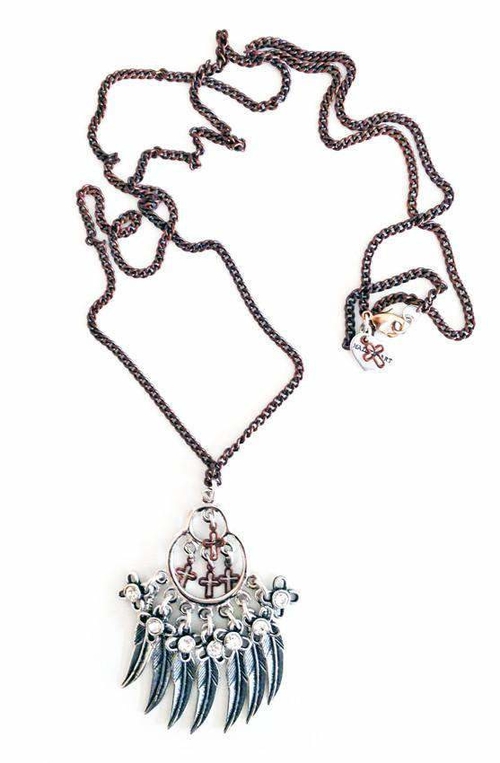 Lariat and Y necklace with feathers, crosses, crystals and charms.