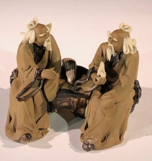 Ceramic FigurineTwo Mud Men Sitting On A Bench with Musical Instrument