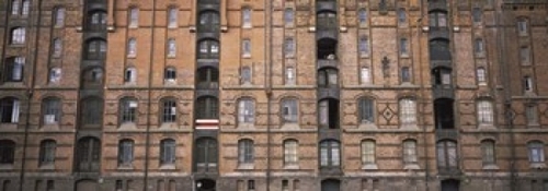 Panoramic Images PPI130690L Low angle view of warehouses in a city  Sp