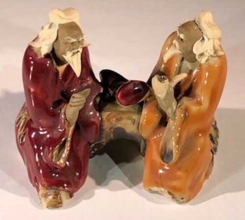 Ceramic FigurineTwo Men Sitting On A Bench - 2.5" Color: Red & Orange