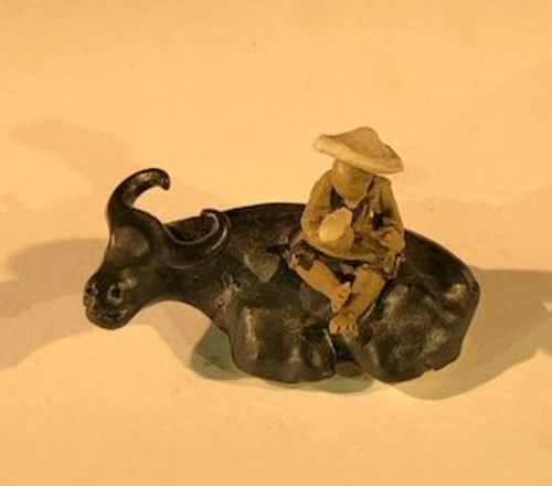 Ceramic FigureMan Sitting On Sitting BuffaloSmall