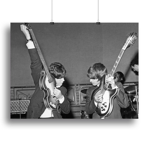 Paul McCartney and George Harrison tune their guitars Canvas Print or