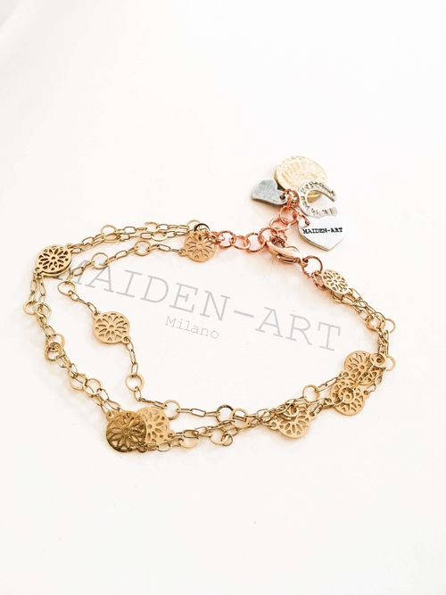 Gold coin bracelet with horseshoe and heart charms. Coin Jewelry.