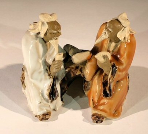 Ceramic FigurineTwo Men Sitting On A Bench - 2.5"Color: White & Orange